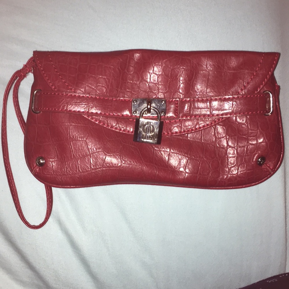 Jennifer Lopez wristlet color-burgundy